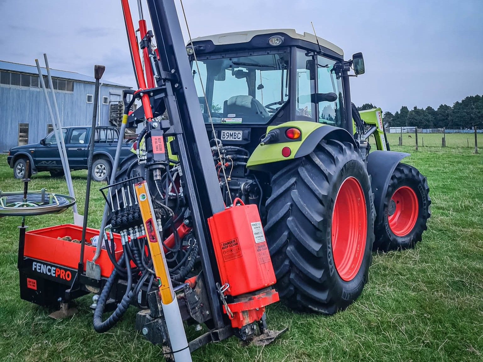 Contractor's FencePro SM900 Sidemount Base rig with spade, hand rammer, and fencing tools organized for efficient operation