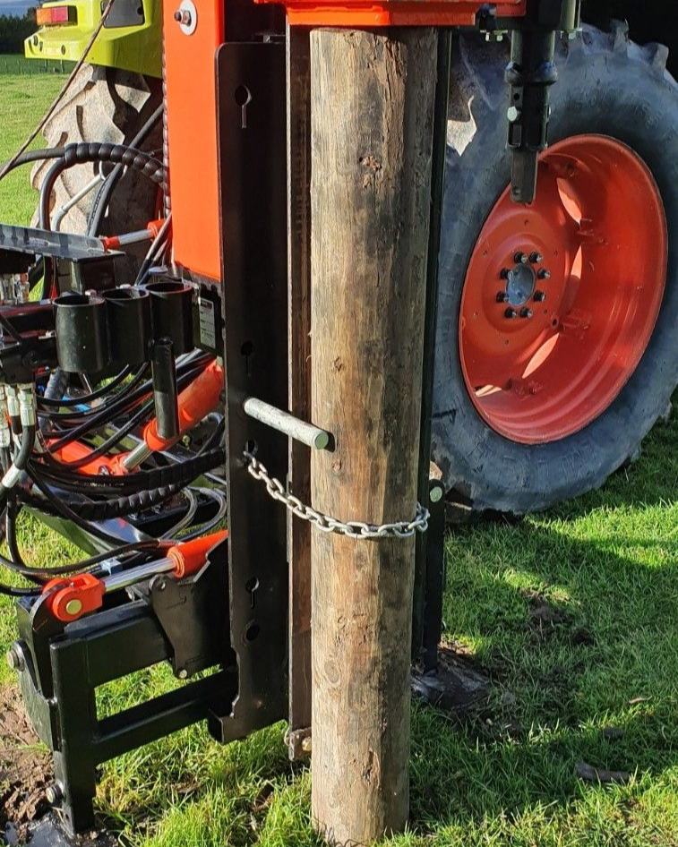 FencePro Pin & Chain Post Steering System — chain wrapped firmly around the post with the steering pin engaged against it. A contractor-proven alternative to the postcap for precise post alignment on your hydraulic post driver.
