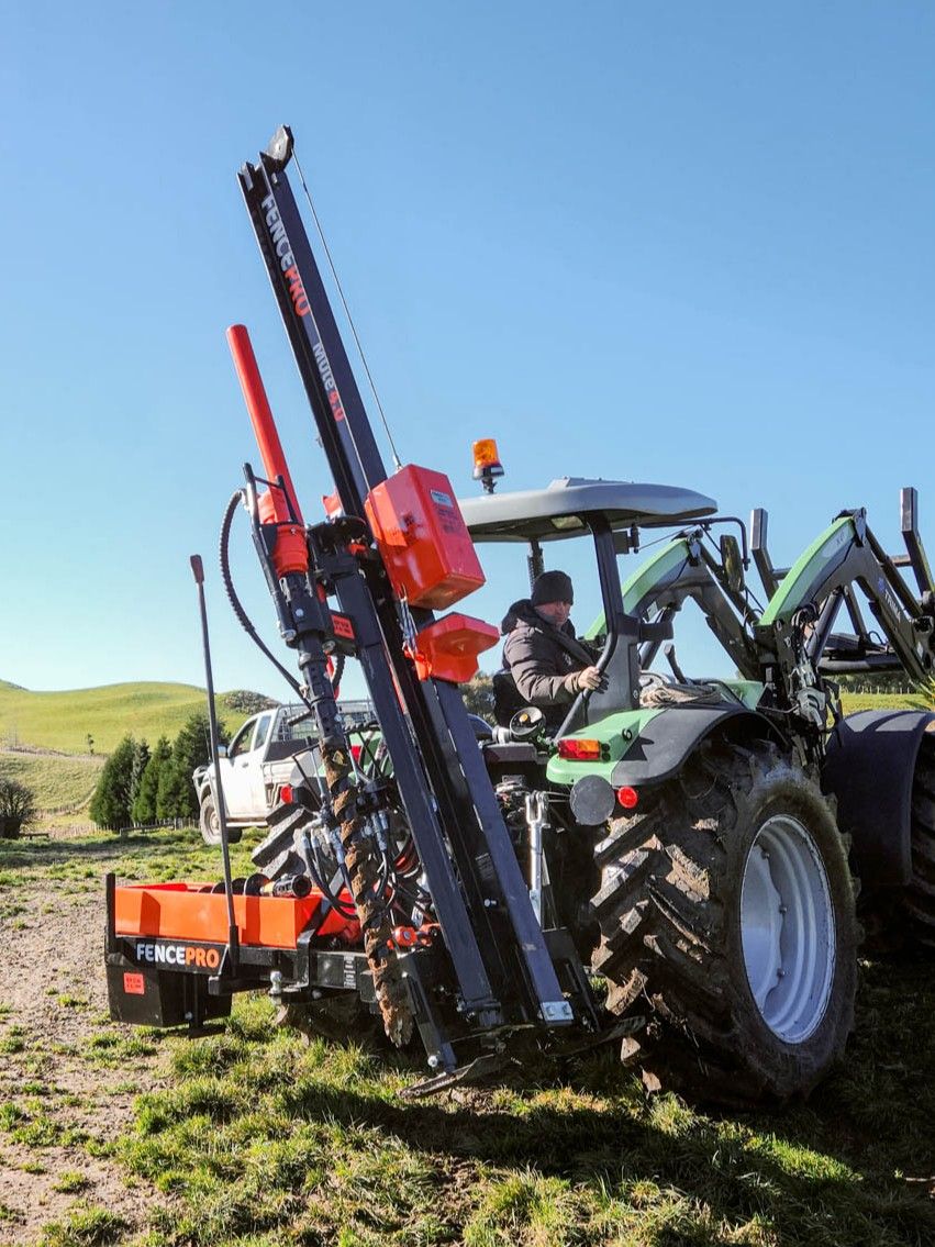 Near-side manually positioned FencePro UltraGlide rockspike kit with Rock Drill attachment on tractor, modular system for hard, stony ground conditions