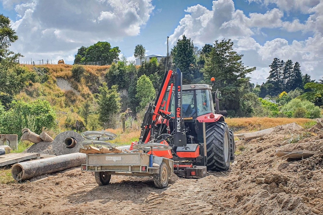 FencePro Ultra G2S post driver with RB800 180° rotating base folded for transport behind tractor