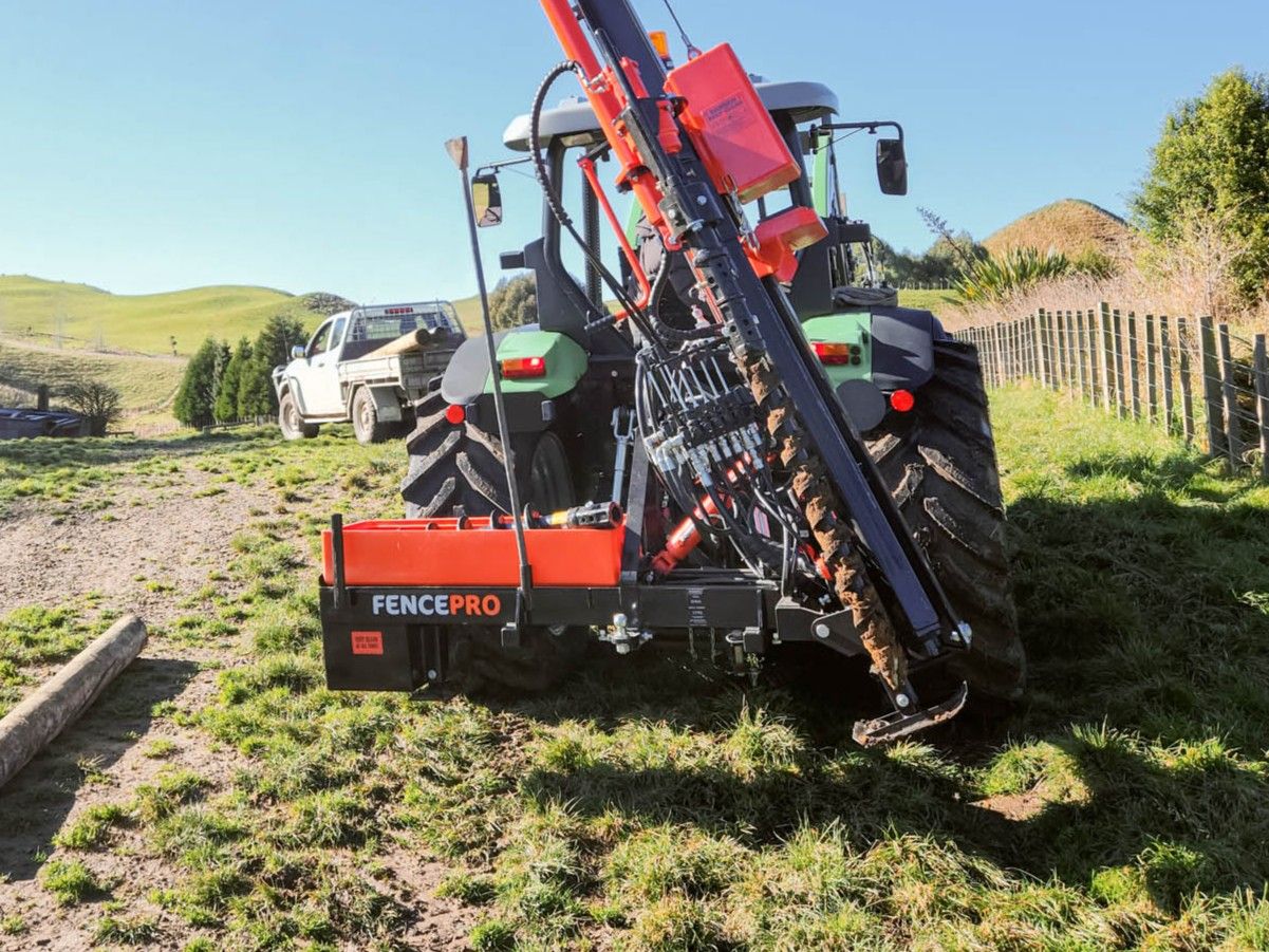 FencePro Mule post driver mounted on SM900 Sidemount Base with hand rammer secured in holde