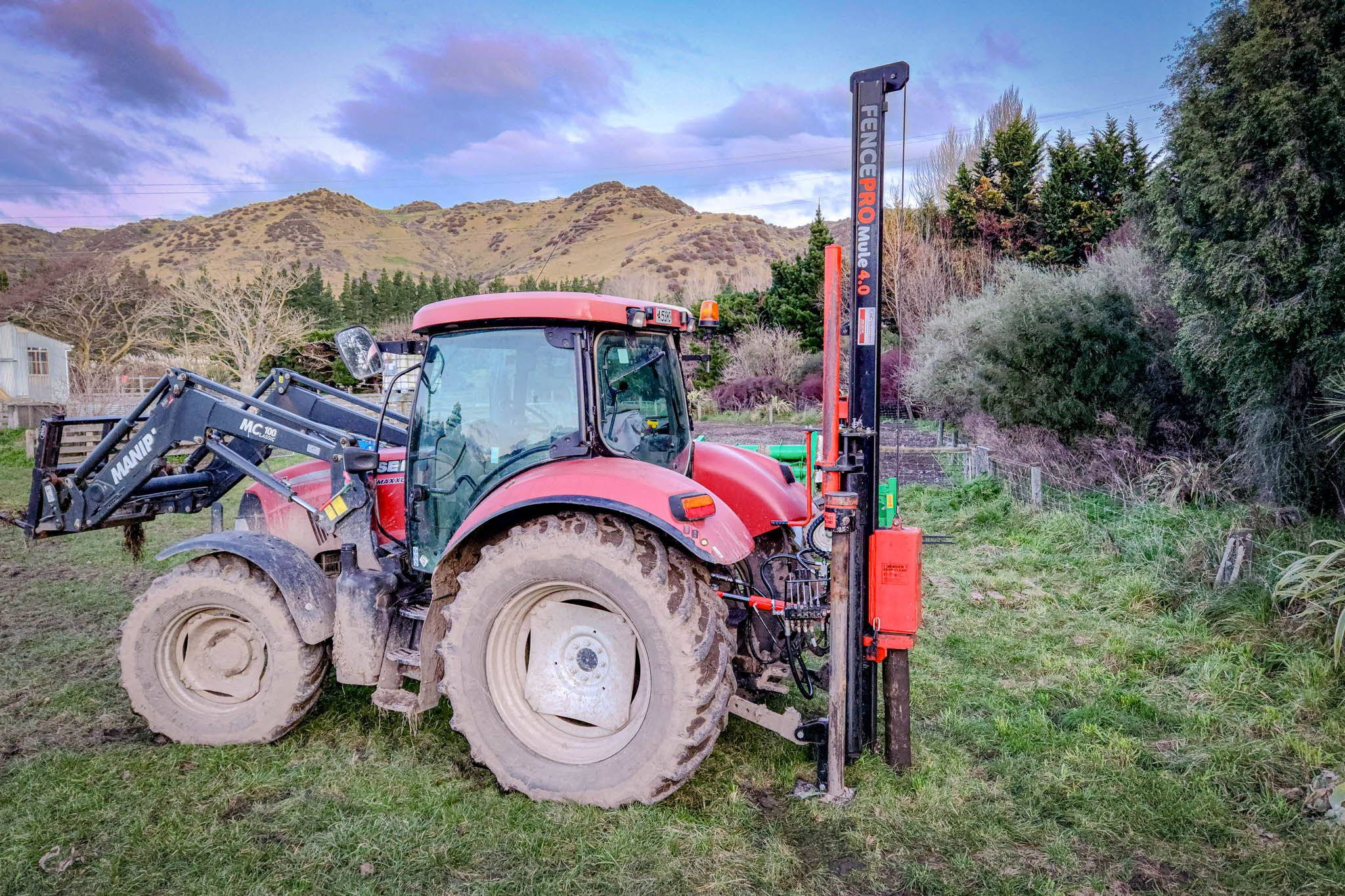 FencePro Mule post driver with 4m mast and Rockspike kit on a Case tractor in Canterbury.