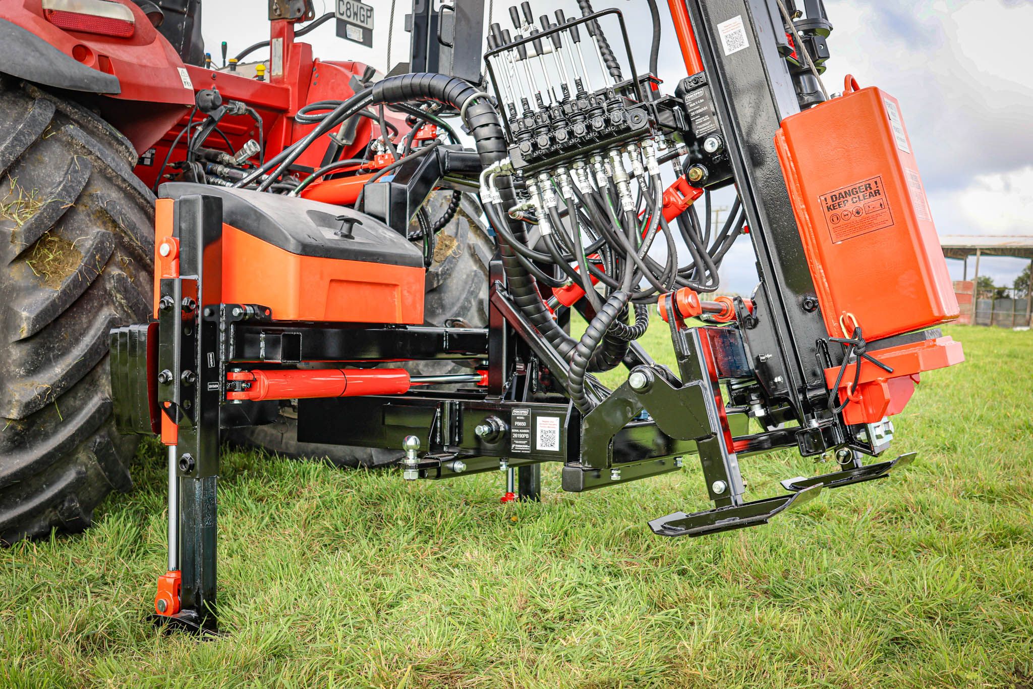 FencePro PB650 base with post driver in the rear mount transport position, kept close to the tractor for safer transport.