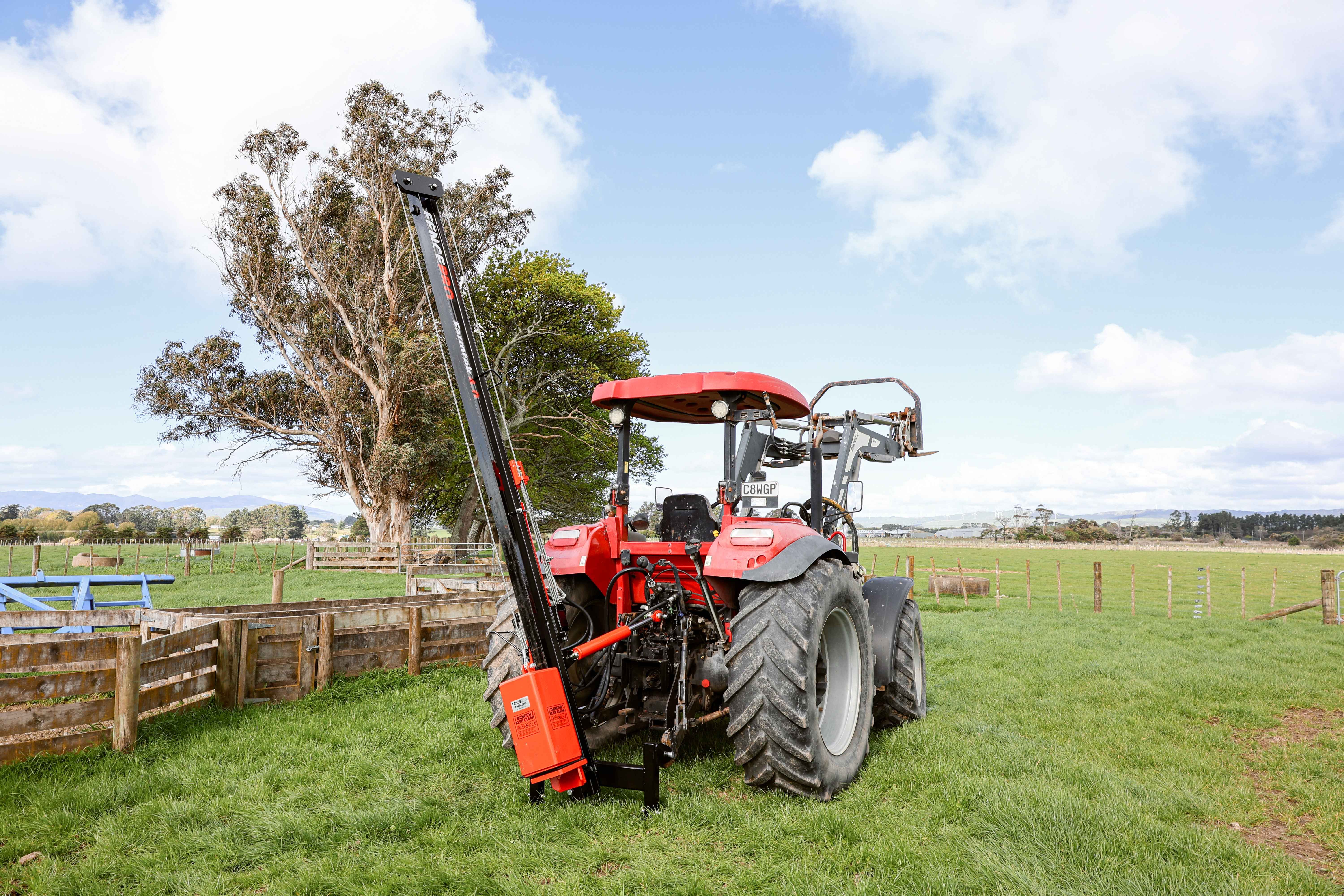Hydraulic control levers on FencePro Farmtek post driver for tilt and top link adjustment