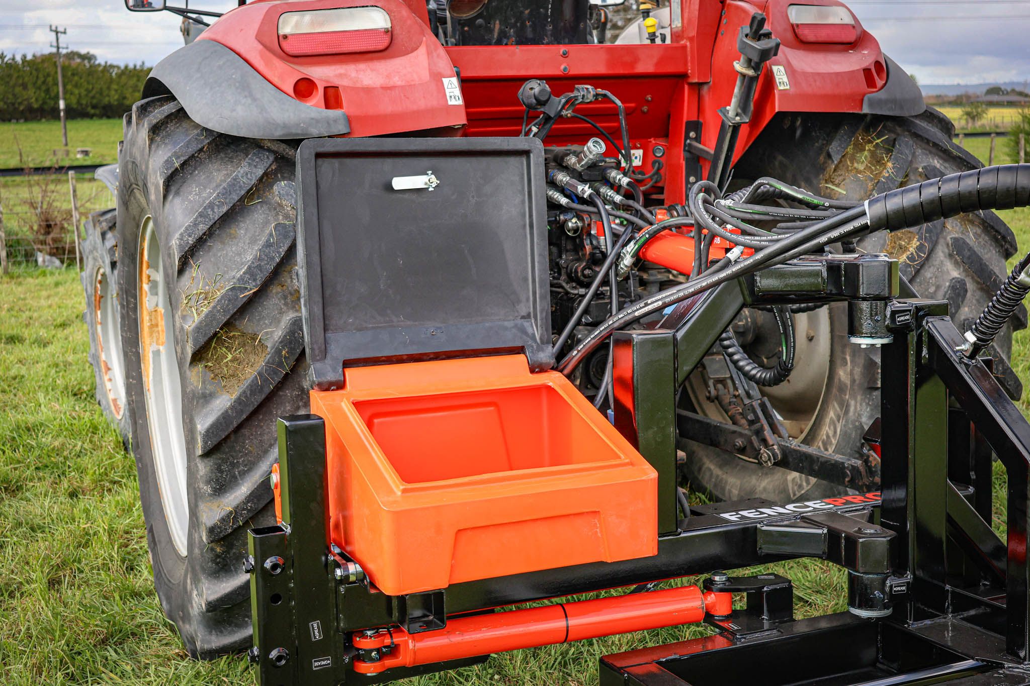 Close-up of the FencePro PB650 post driver base showing the lockable toolbox for secure tool storage.
