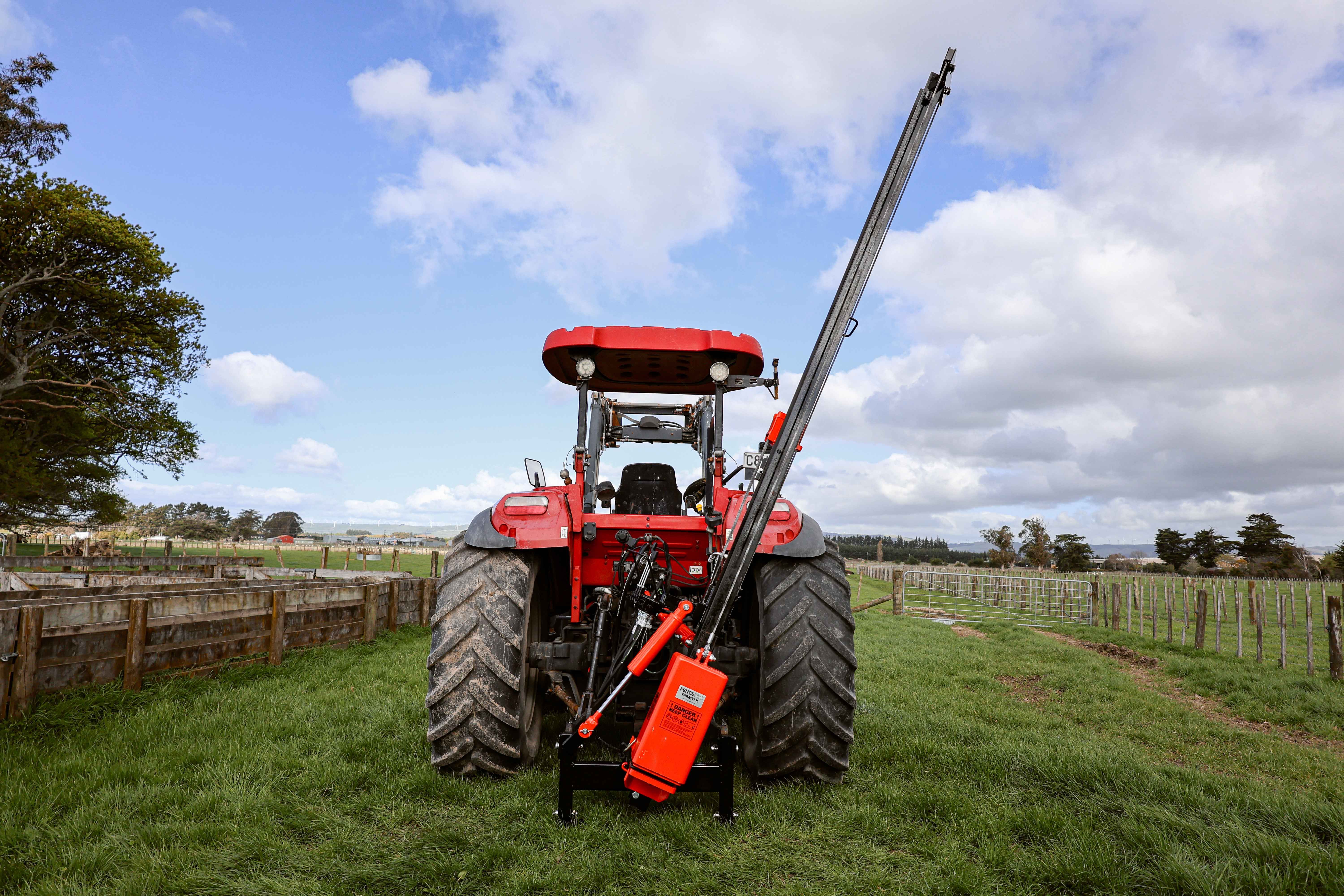 FencePro Farmtek post driver mounted on tractor ready for fencing in NZ paddock