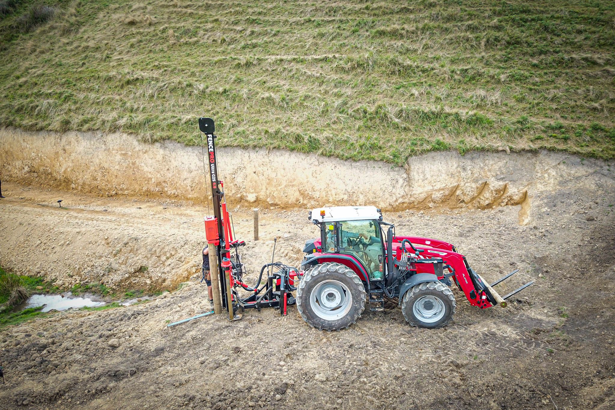ost rammer mounted on a FencePro PB650 base, rotated to the rear of the tractor for hill country fencing.