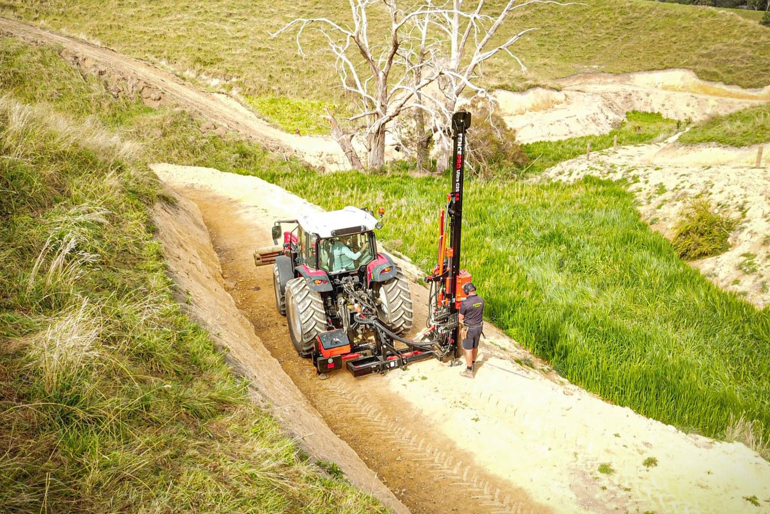 Fencing contractor using the FencePro PB650's 650mm of shift to push the post driver out to the fence line in side mount position.
